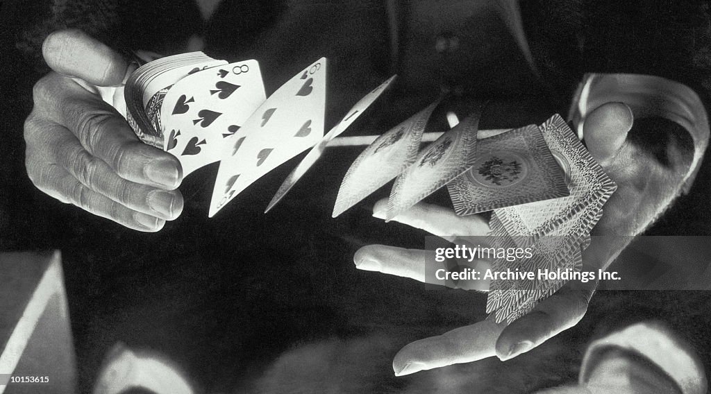 MANS HANDS SHUFFLE A DECK OF CARDS, 1950S