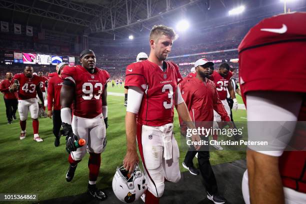 Quarterback Josh Rosen of the Arizona Cardinals walks off the field following the first half of the preseason NFL game against the Los Angeles...