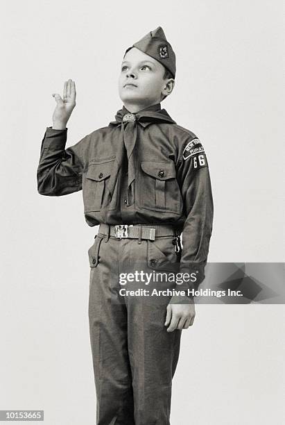 boy scout saluting - scouts stockfoto's en -beelden