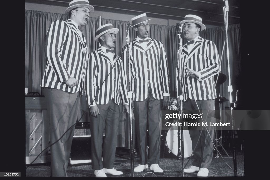 BARBERSHOP QUARTET PERFORMING ON STAGE