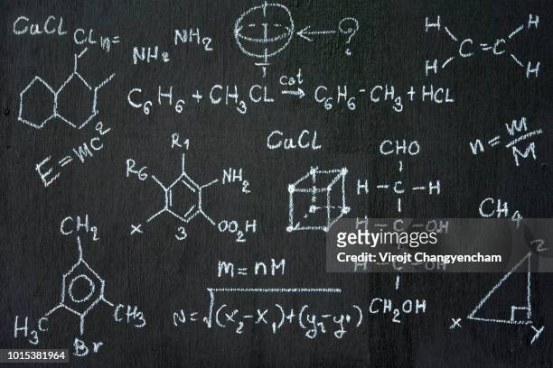 chalkboard inscribed with scientific formulas and calculations in physics and mathematics. vector illustration - formula fotografías e imágenes de stock