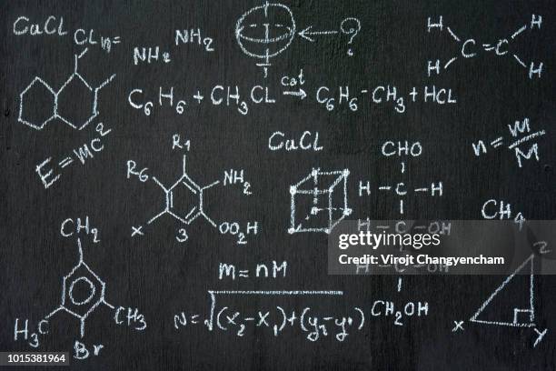 chalkboard inscribed with scientific formulas and calculations in physics and mathematics. vector illustration - science physics stock pictures, royalty-free photos & images