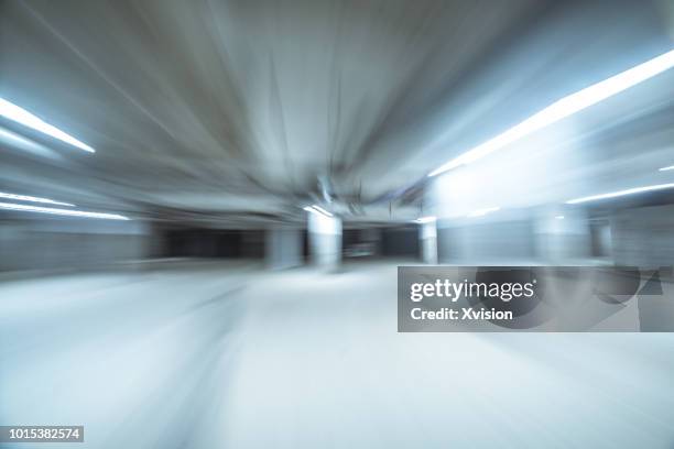 under ground parking lot in motion blur - building story stock pictures, royalty-free photos & images