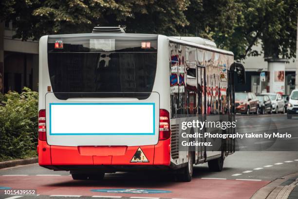 bus with blank billboard - getting on bus stockfoto's en -beelden