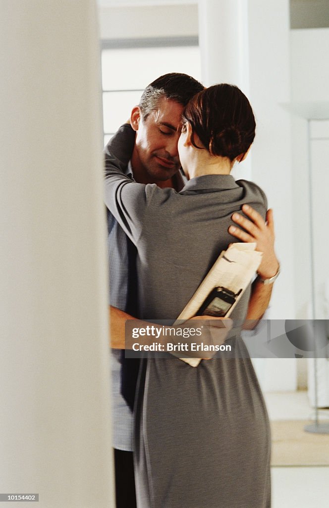 Young couple dancing at home