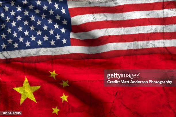 american flag china flag with texture - china v united states stock-fotos und bilder