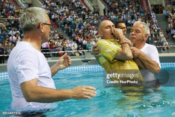 Believers are are baptised in the pool during &quot;Be Courageous!&quot; Convention of Jehovahs Witnesses in Tauron Arena in Krakow, Poland on 11...