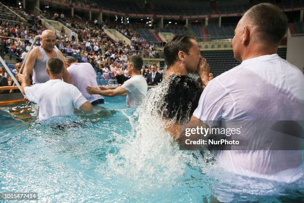 Believers are are baptised in the pool during &quot;Be Courageous!&quot; Convention of Jehovahs Witnesses in Tauron Arena in Krakow, Poland on 11...