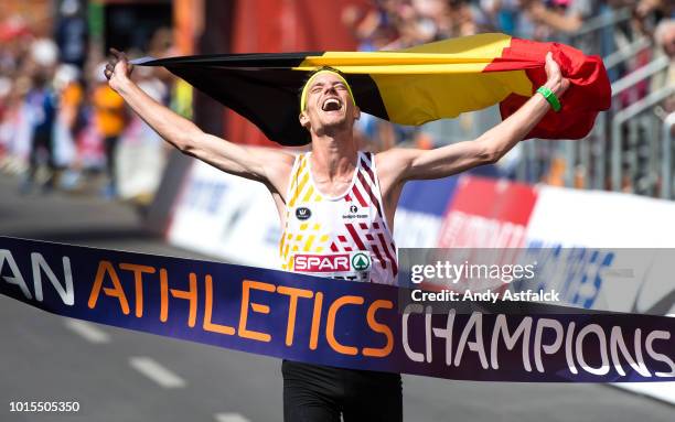 Koen Naert from Belgium crosses the line first at the Men's Marathon on day six of the 24th European Athletics Championships at Olympiastadion on...