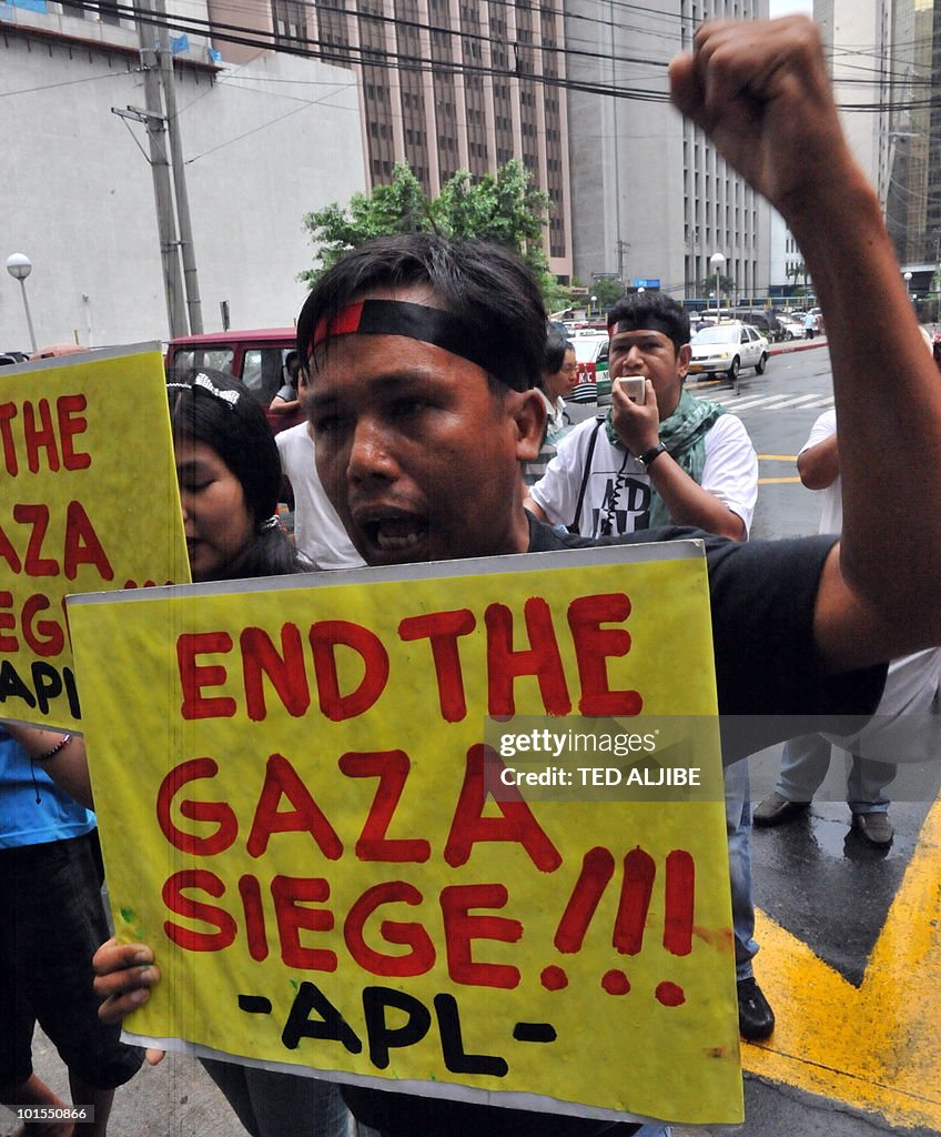 A Protester carries a placard and shouts