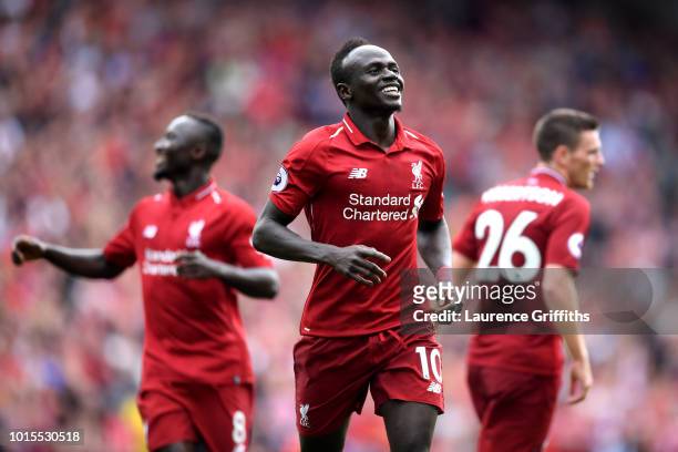 Sadio Mane of Liverpool celebrates after scoring his team's third goal during the Premier League match between Liverpool FC and West Ham United at...