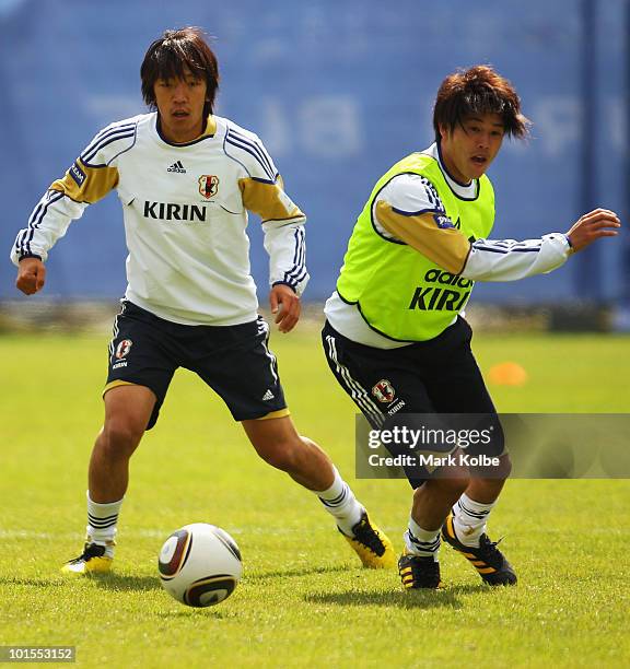 Shunsuke Nakamura and Atsuto Uchida watch the ball during a Japan training session at Saas-Fee Stadium on June 2, 2010 in Saas-Fee, Switzerland.