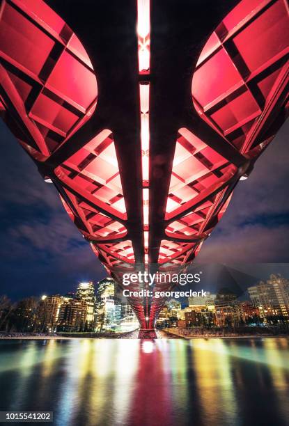 view from below the peace bridge in calgary - bridge architecture up close night stock pictures, royalty-free photos & images