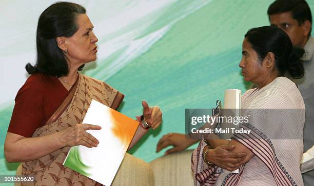 Chairperson Sonia Gandhi and Railways Minister Mamata Banerjee at the release of UPA's 'Report to The People' on completion of one year of UPA's...