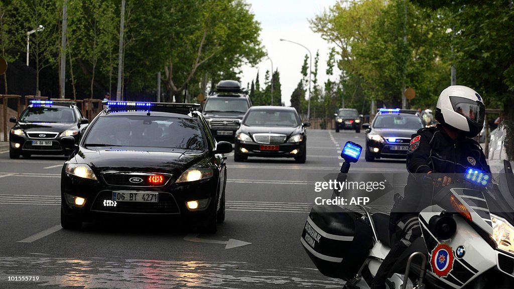 A car (R) transporting Turkish Prime Min