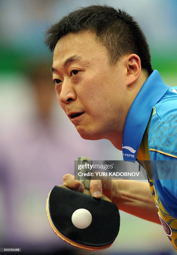Ma Lin of China returns a service to Rus