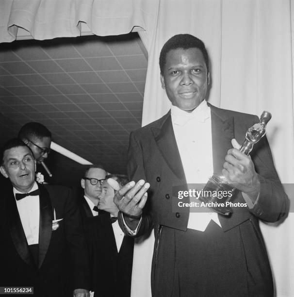 American actor Sidney Poitier with his Oscar after he won the Academy Award for Best Actor in a Leading Role, at the Beverly Hilton Hotel in...