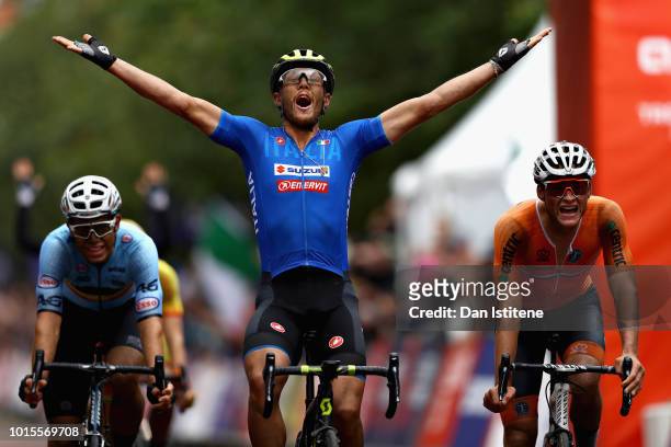 Matteo Trentin of Italy celebrates as he crosses the line and wins gold in the Men's Road Race during the road cycling on Day Eleven of the European...