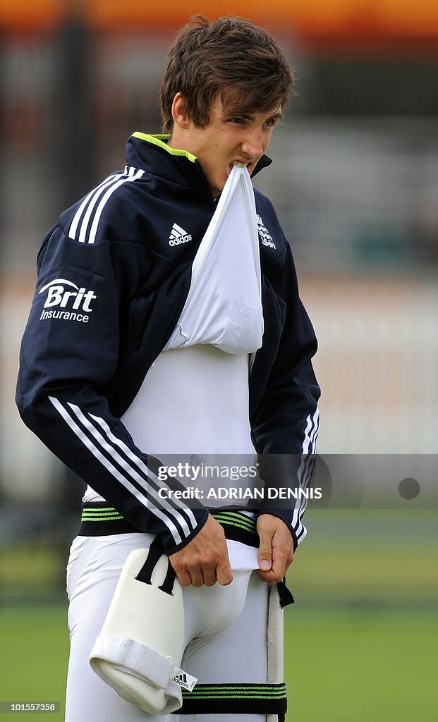 England cricketer Steve Finn adjusts his