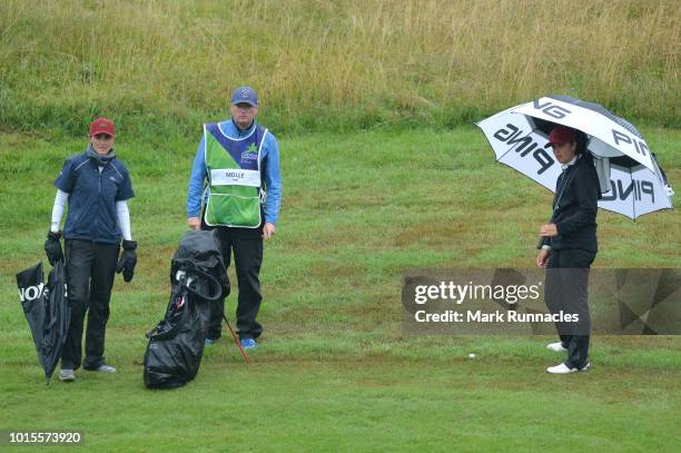 Justine Dreher and Manon Molle of France 2 line up a shot on the 14th hole during the team competition women foursomes gold medal match between...