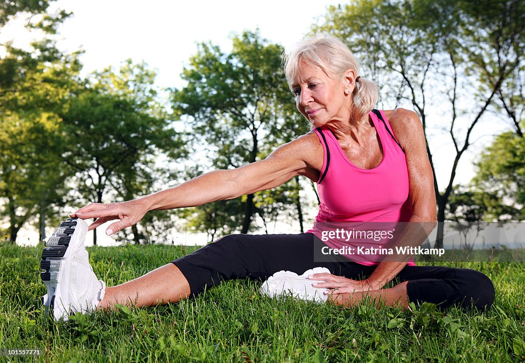 Older woman stretching.