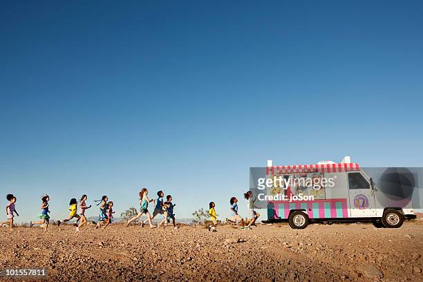 kids running to ice cream truck,  nevada deser - large group of people running stock pictures, royalty-free photos & images