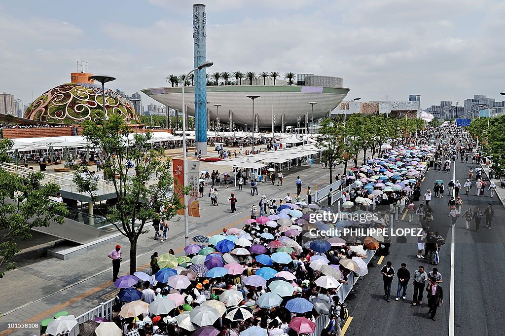 Visitors queue at the site of the World