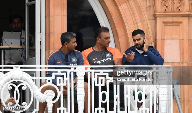 India captain Virat Kohli chats with coach Ravi Shastri on the dressing room balcony during day 4 of the Second Test Match between England and India...