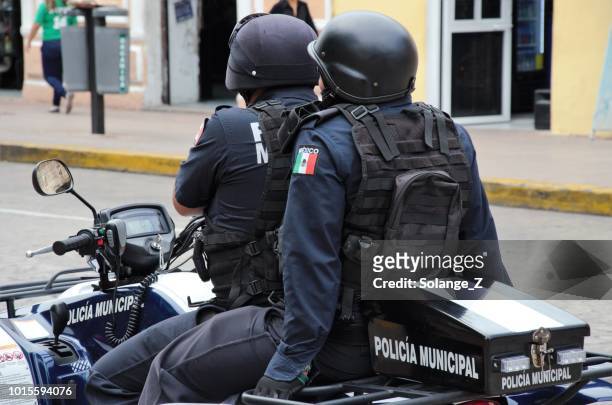 mexican police on motorcycle in merida, mexico - mexican police stock pictures, royalty-free photos & images
