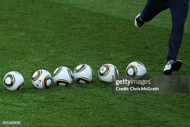 Member of the US national soccer squad kicks a line of balls during practice on June 2, 2010 in Pretoria, South Africa.