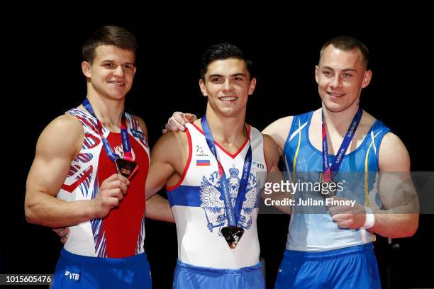 Dmitrii Lankin of Russia , Artur Dalaloyan of Russia and Igor Radivilov of Ukraine pose for a photo with their medals after the Men's Vault...