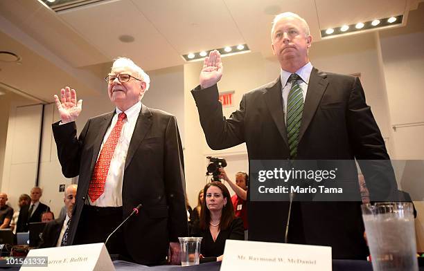 Warren Buffett , Chairman and CEO of Berkshire Hathaway, and Raymond W. McDaniel, Chairman and CEO of Moody's Corporation, are sworn in to testify...