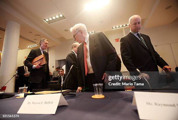 Warren Buffett , Chairman and CEO of Berkshire Hathaway, and Raymond W. McDaniel , Chairman and CEO of Moody's Corporation, prepare to testify before...