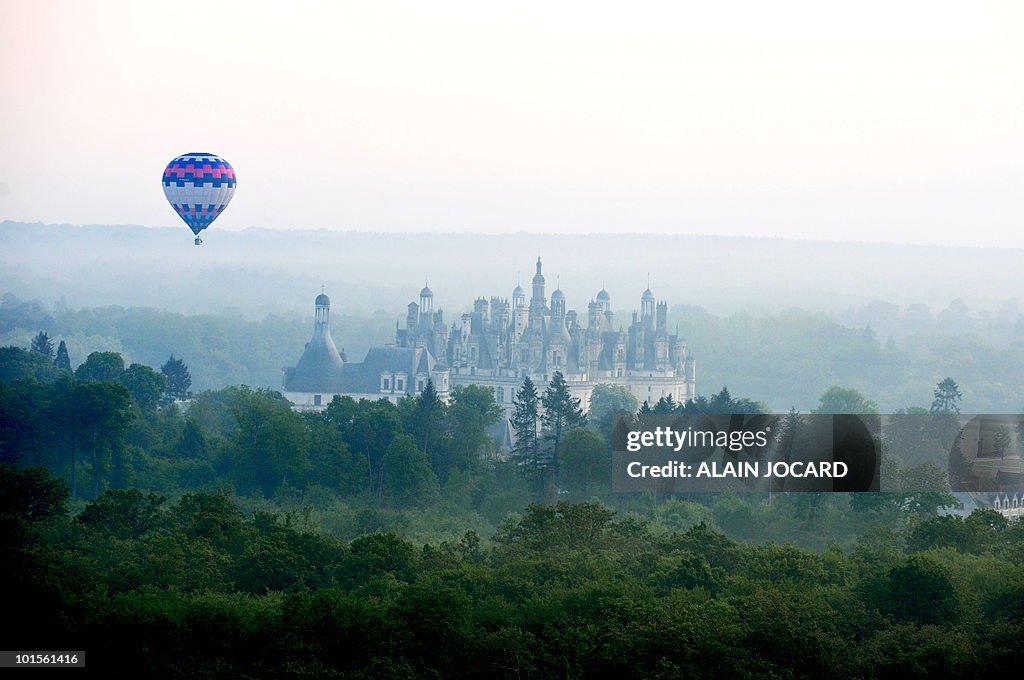 A hot air-balloon flies above the French