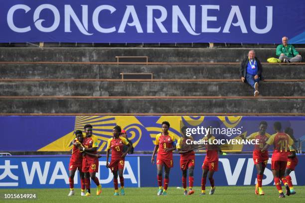 Ghana's team players celebrate at the end of the Women's World Cup U20 Group B football match between Ghana and New Zealand on August 12 at the Guy...