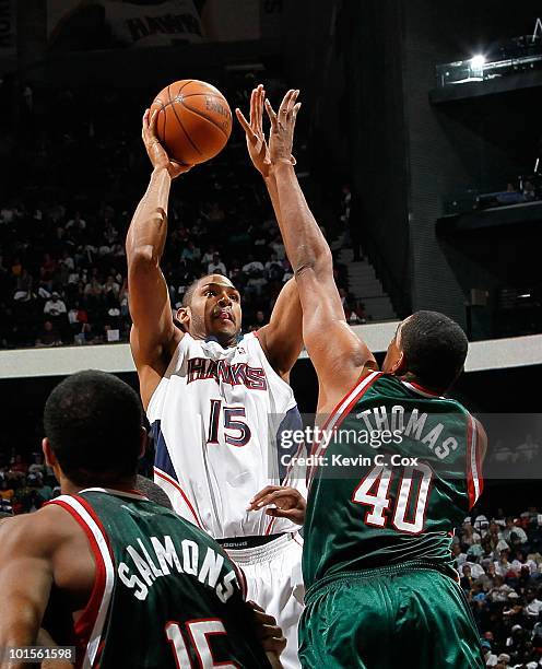 Al Horford of the Atlanta Hawks against John Salmons and Kurt Thomas of the Milwaukee Bucks during Game Five of the Eastern Conference Quarterfinals...