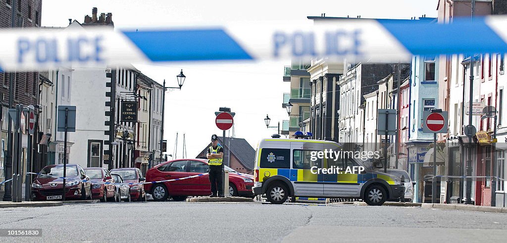 A police officer guards the scene of a s