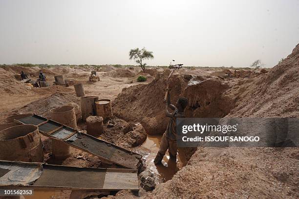 Gold miner digs the earth hoping to find some gold on May 9, 2010 in Namisgma. Namisga is the most important gold site in Burkina Faso and is...