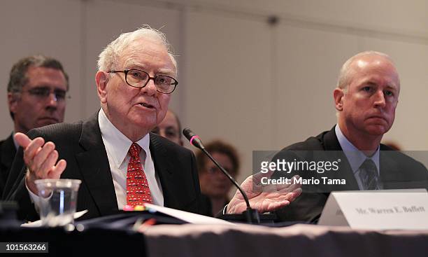 Warren Buffett , Chairman and CEO of Berkshire Hathaway, and Raymond W. McDaniel, Chairman and CEO of Moody's Corporation, testify before the...
