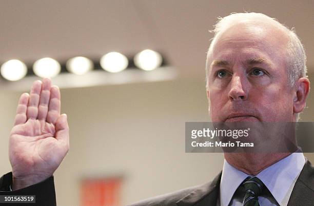 Raymond W. McDaniel, Chairman and CEO of Moody's Corporation, is sworn in to testify before the Financial Crisis Inquiry Commission at The New School...