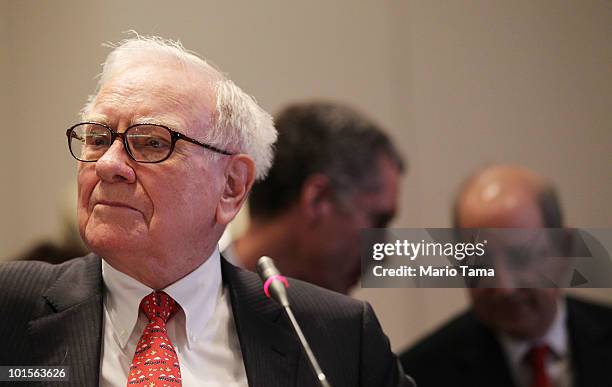 Warren Buffett, Chairman and CEO of Berkshire Hathaway, looks on while testifying before the Financial Crisis Inquiry Commission at The New School...