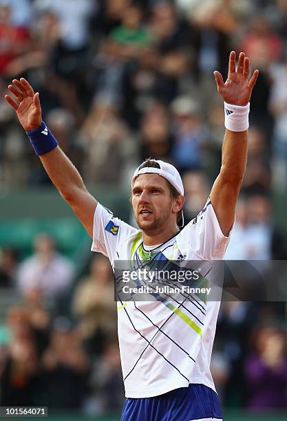 Jurgen Melzer of Austria celebrates winning the men's singles quarter final match between Novak Djokovic of Serbia and Jurgen Melzer of Austria at...