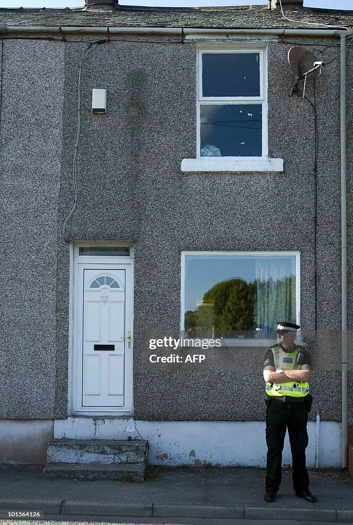 Police officers stand guard outside the