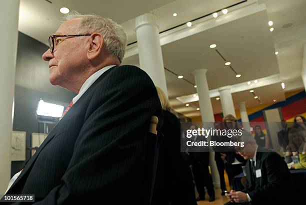 Warren Buffett, chairman and chief executive officer of Berkshire Hathaway Inc., gets ready for a television interview before a hearing of the...