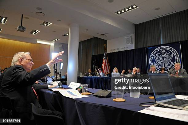 Warren Buffett, chairman and chief executive officer of Berkshire Hathaway Inc., left, testifies at a hearing of the Financial Crisis Inquiry...