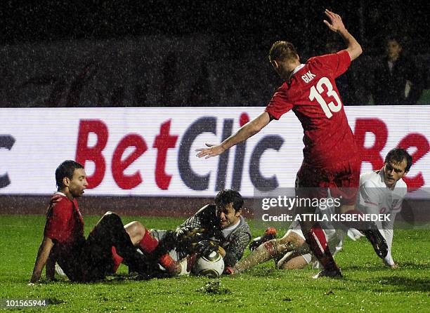 Poland's goalkeeper Kukasz Fabianski saves the ball between his teammates, Kamil Glik , Maciej Sadlok and Serbia's Danko Lazovic during their...