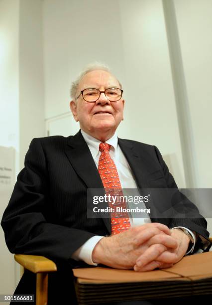 Warren Buffett, chairman and chief executive officer of Berkshire Hathaway Inc., gets ready for a television interview before a hearing of the...