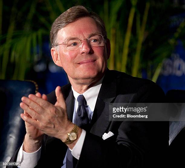 Harold "Terry" McGraw, president and chief executive officer of McGraw-Hill Cos, applauds a speaker at the U.S.-India Business Council meeting in...