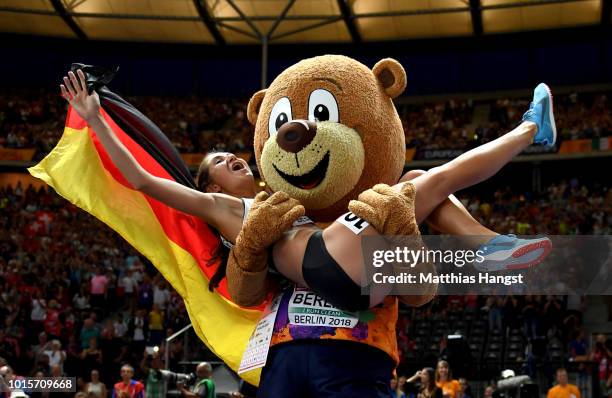 Gesa-Felicitas Krause of Germany celebrates winning gold in the Women's 3000 metres steeplechase final with mascot Berlino during day six of the 24th...