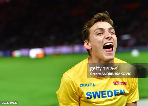 Sweden's Armand Duplantis celebrates after winning the men's Pole Vault final during the European Athletics Championships at the Olympic stadium in...